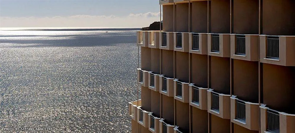 What are the best hotels near Spiaggia di Tuerredda? contacts